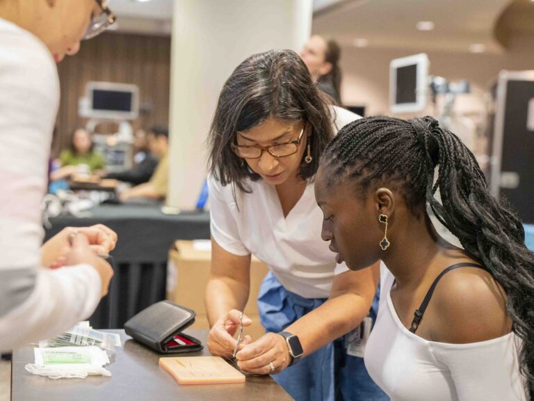 Attendees participating in a hands-on business workshop activity at an indoor professional event
