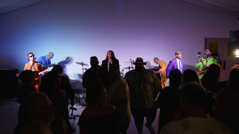 Live band performing at a Winnipeg social with guests dancing