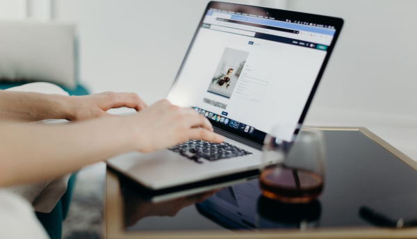Person working on a laptop to improve website performance and online business results