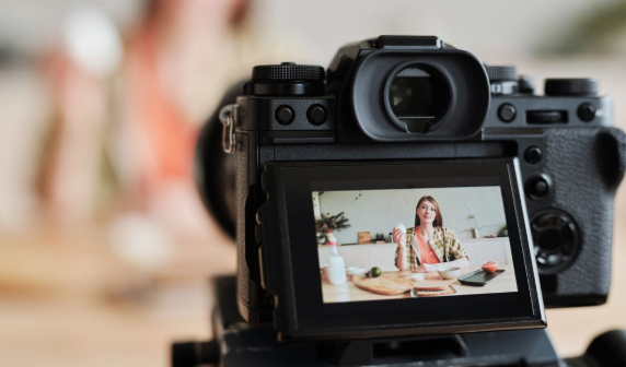 Camera filming a woman for professional brand content creation