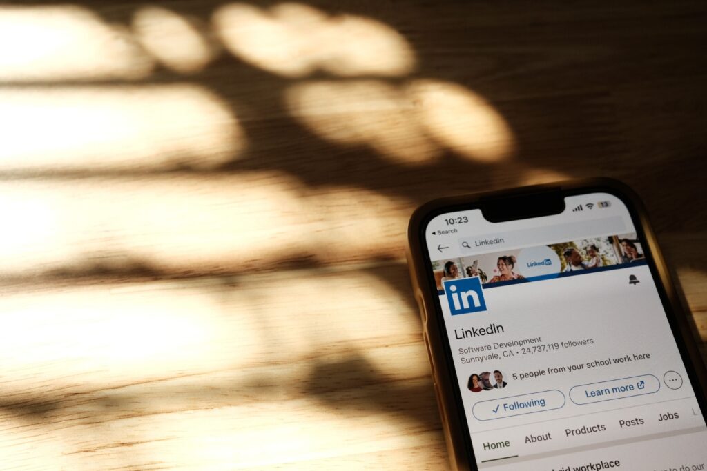 Smartphone showing a LinkedIn page for social media content planning
