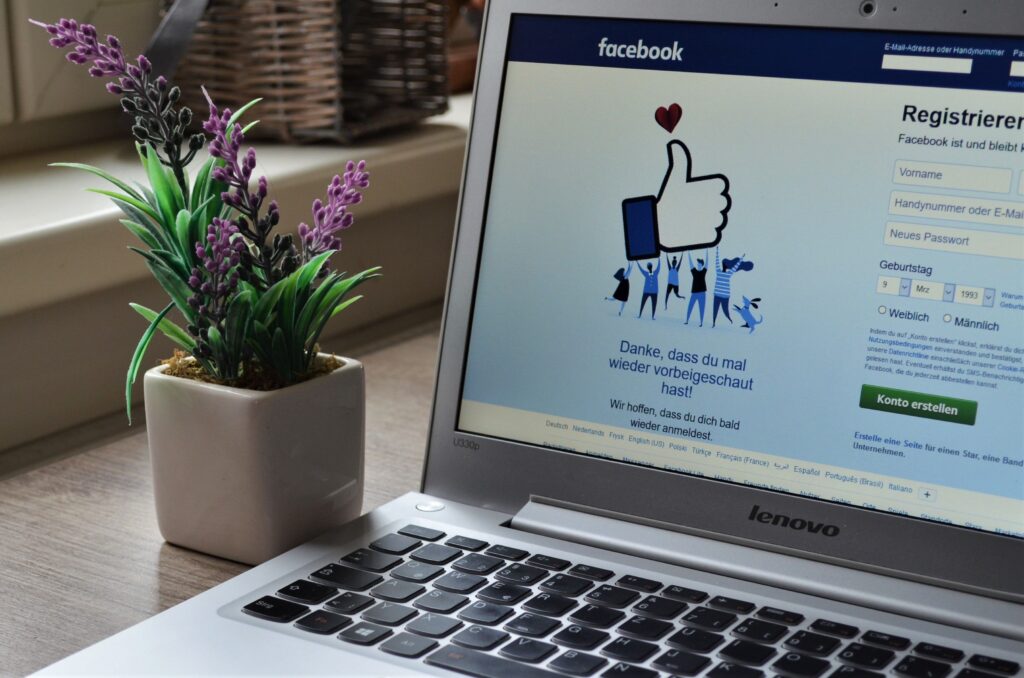 Laptop showing Facebook page for social media marketing
