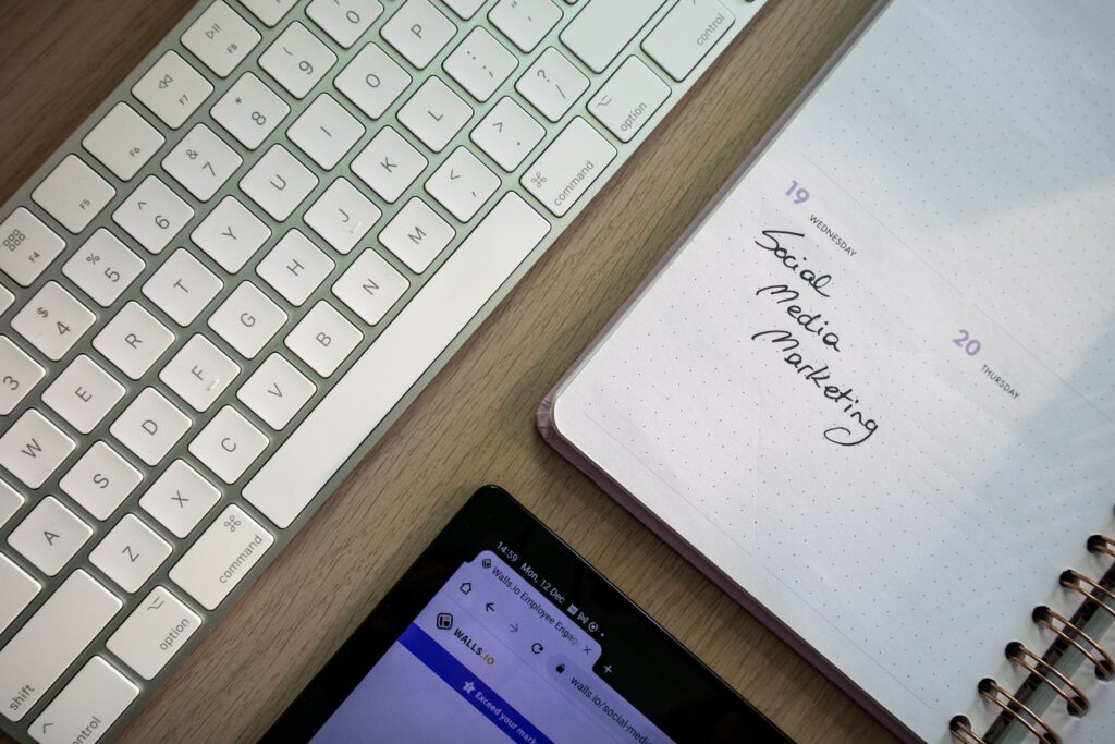 Social media marketing planner with keyboard and phone on a desk
